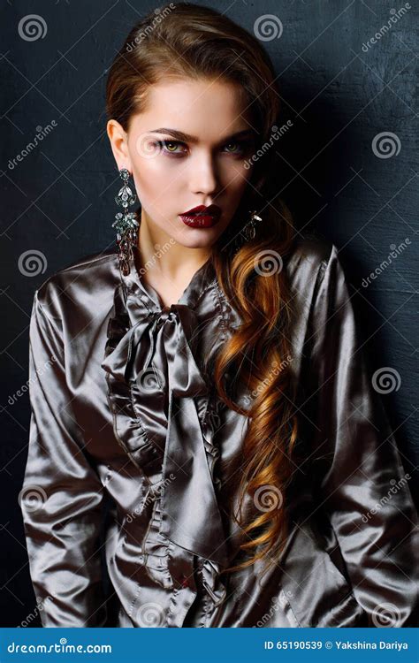 Gorgeous Woman With Long Dark Curly Hair Wears Elegant Dress And Bijou