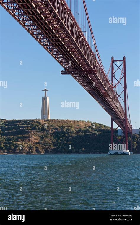 April Th Bridge Across River Tagus And Cristo Rei Statue Lisbon