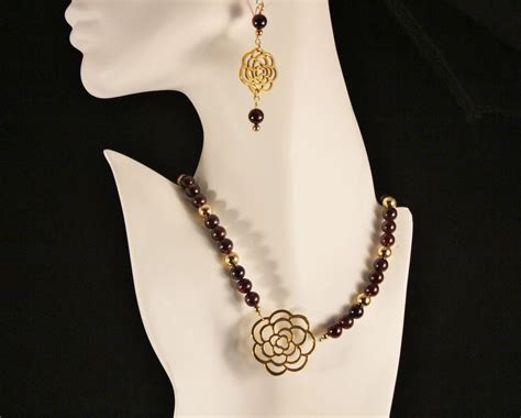 Golden Flower Connector And Garnet Handcrafted Gold Necklace And