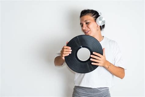 Premium Photo A Woman Holding A Record That Saysmusic Is The Best