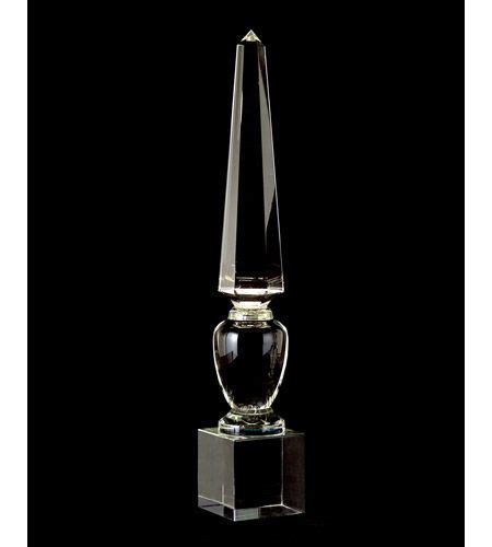 A Clear Glass Trophy With A Black Base On A Black Background In The