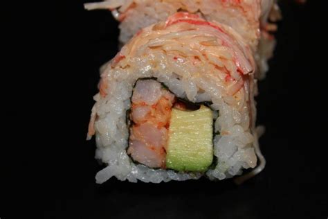 American Sushi Roll Spicy Shrimp With Avocado With Spicy Crab On Top