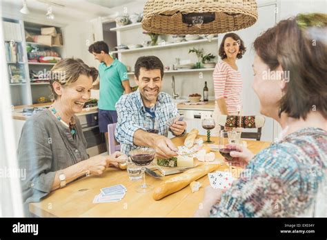 Friends playing cards home hi-res stock photography and images - Alamy