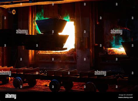 Loading Ingots Of Remelt Copper Into Reverberatory Furnace Stock Photo