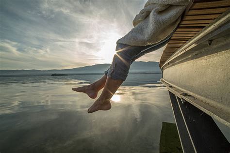 Feet Hanging From Dock Stock Photos Pictures And Royalty Free Images