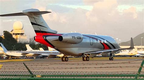 Bombardier Challenger Taking Off And Helicopter Landing On Runway 10 At