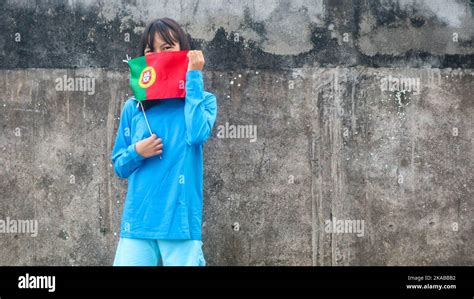 A Little Girl With A Portugal Flag Stock Photo Alamy