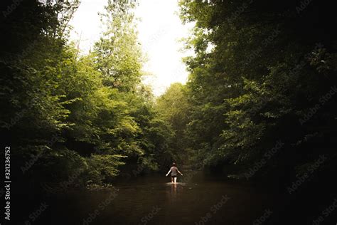 Mujer Caminando En El Rio Entre La Naturaleza Stock Photo Adobe Stock