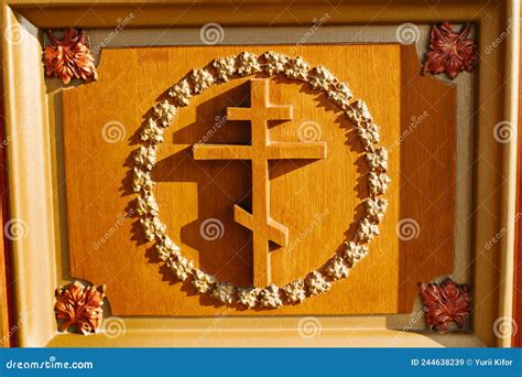 Wooden Cross In Front Of Ruined Buildings In The Martyr Village Of