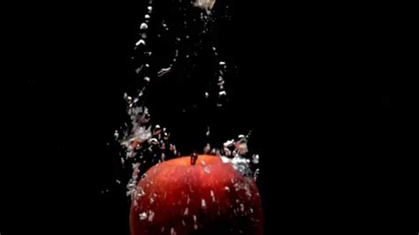 One Red Apple Falling Into Transparent W Stock Video Pond