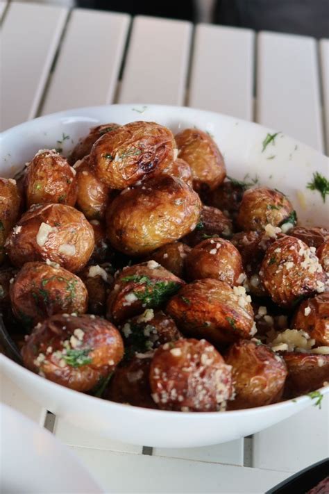 A White Bowl Filled With Food Sitting On Top Of A Table