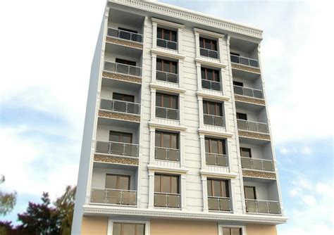 A Tall White Building With Balconies And Windows