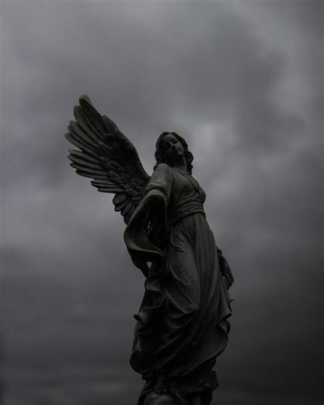 A statue of an angel on a cloudy day photo – Free Minnesota Image on
