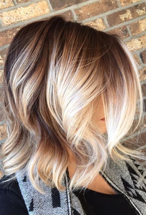 Brown To Blonde Balayage With Chunky Blonde Pieces Framing The Face