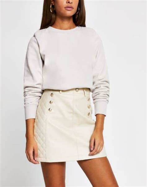 River Island Belted Quilted Faux Leather Mini Skirt In Beige Asos