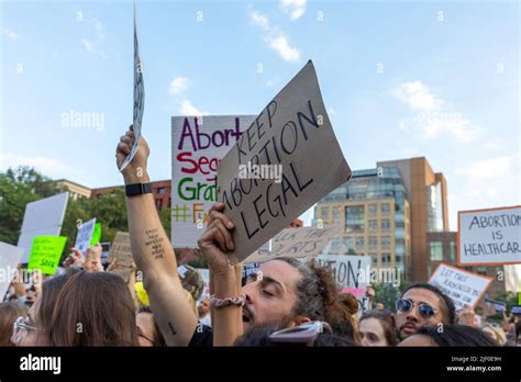 A Crowd Of Protesters Holding Cardboard Signs After The Supreme Court