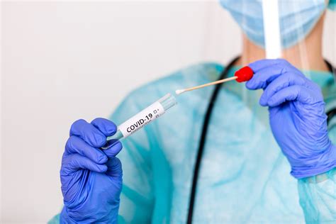 Lab Technician Holding Swab Collection Kit Coronavirus COVID 19