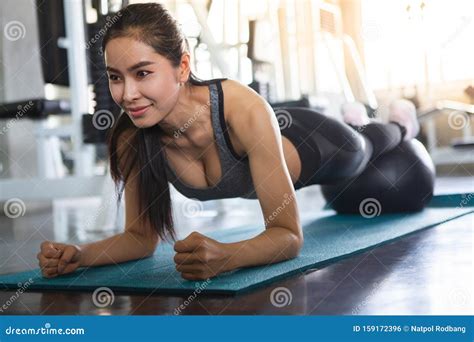 Beautiful Asian Fitness Young Woman In Sportswear Doing Plank With Ball