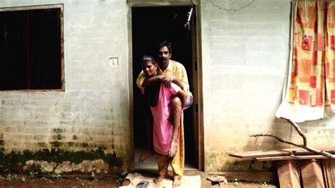 Suja Carries Her Paralyzed Husband On Her Shoulder For Eight Years