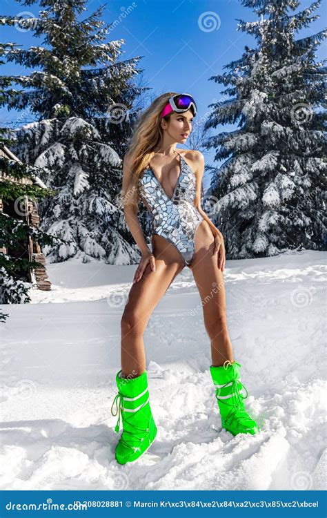 Girl in a Silver Bikini Posing in Winter at a Ski Resort. Winter Fashion Model Stock Image ...