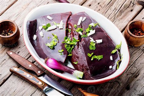 Raw Uncooked Liver For Cooking On Wooden Table 13665560 Stock Photo At