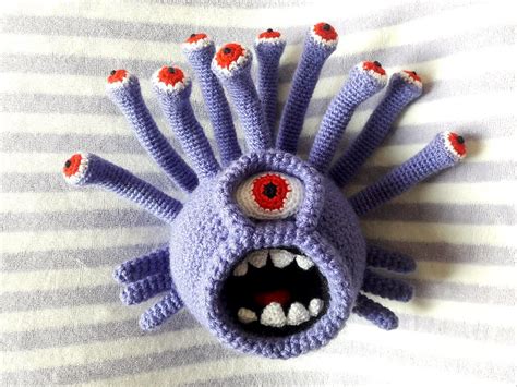 A Crochet Amigurumi Plushie Based On The Beholder Monster From Dungeons