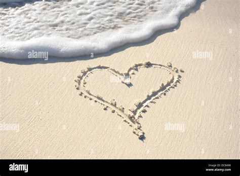 Love Heart Drawn In The Sand On A Beach Stock Photo Alamy