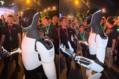 Teslas Optimus Humanoid Robot Interacts With Guests At We Robot Event