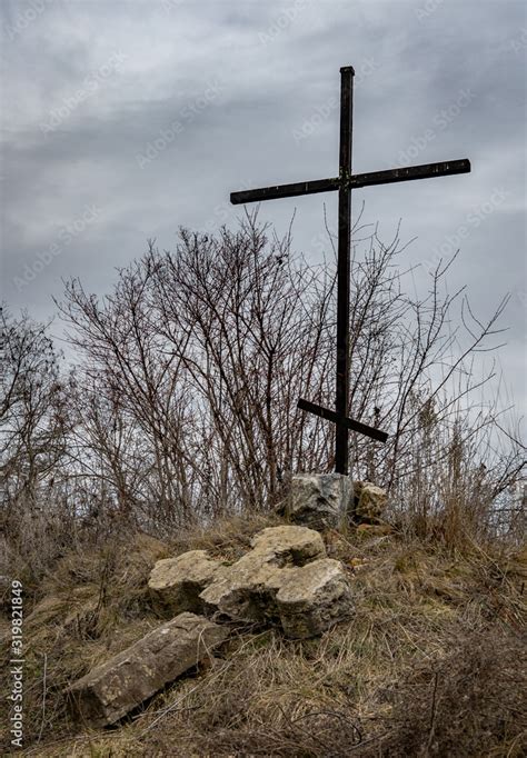 Old Stone Church Cross Near An Abandoned Ruined Church Stock Photo