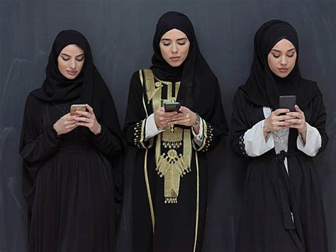 Traditional Attire A Portrait Of Arab Women In Abayas Photo Background