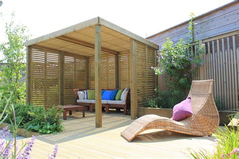 A Decked Area With The Retreat Shelter Back Garden Design Rooftop