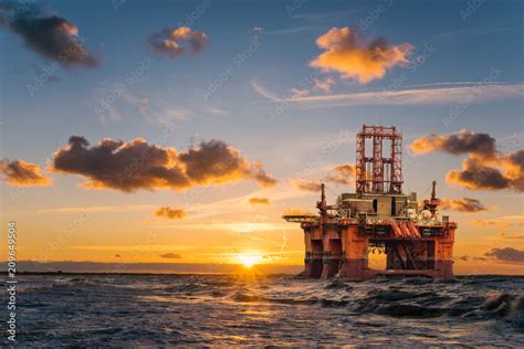 Offshore Oil Rig At Sunset Stock Photo Adobe Stock