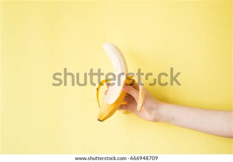 Human Hand Holding Banana Fruit Nutrition Stock Photo 666948709