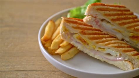 ham cheese sandwich with egg and fries 6654201 Stock Video at Vecteezy