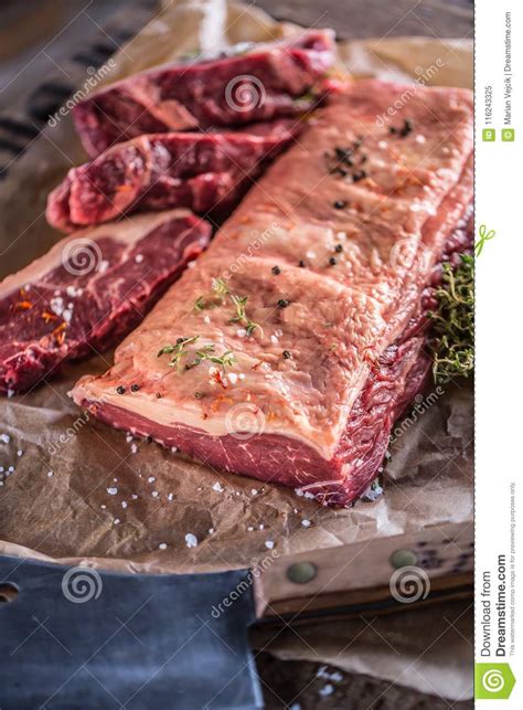 Raw Rib Eye Beef Steak With Salt Spices And Herbs Stock Image Image