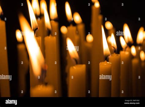 Close-up of church candles on the dark background Stock Photo - Alamy