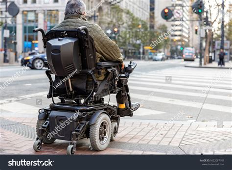 Elderly Disabled Person On Electric Wheelchair Stock Photo 1622087701