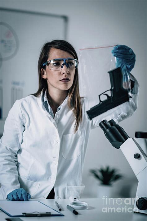 Forensics Expert Examining Crime Scene Evidence Photograph By Microgen Images Science Photo