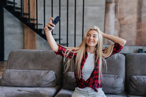 Premium Photo Gorgeous Blonde Caucasian Woman In Plaid Shirt Holding