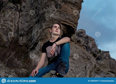 Young Attractive Man Located With On The Top Of Mountains Stock Image