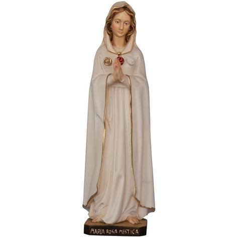 A Statue Of The Virgin Mary Holding A Rose