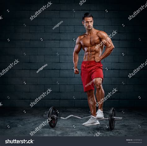 Handsome Fit Muscular Men Lifting Weoghts Stock Photo 1410743612