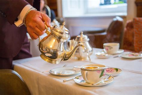 Gallant Waiter Pouring the Tea, Traditional English Afternoon Tea Ceremony Stock Image - Image ...