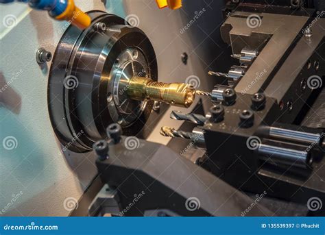 The Cnc Lathe Or Turning Machine Cutting The Thread At The Brass Shaft