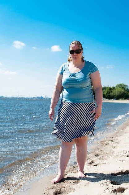 Premium Photo Full Length Portrait Of Overweight Woman Standing At Beach