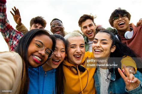 Group Of Multiracial Teen College Friends Having Fun Outdoors Happy