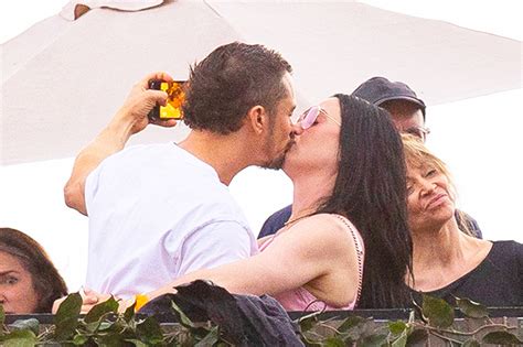 Katy Perry & Orlando Bloom Kiss While Swimming During Vacation: Photos ...