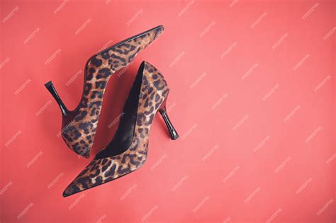 Premium Photo Leopard Print Shoes High Heels On Red Background Top View