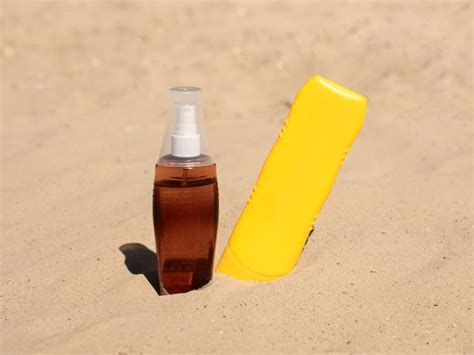 Premium Photo Yellow Plastic Bottle And Oil In A Transparent Bottle