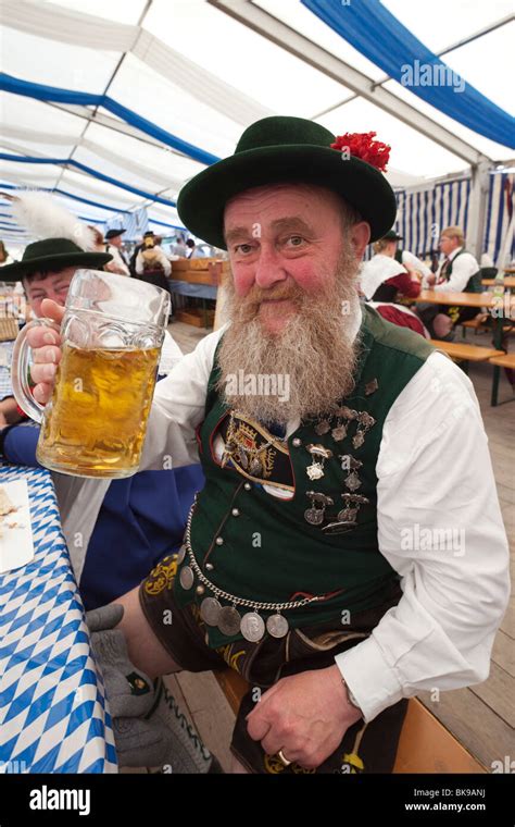 Senior man drinking beer during Oktoberfest, Munich, Bavaria, Germany ...